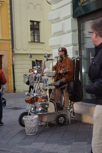 Man cycling on street in city