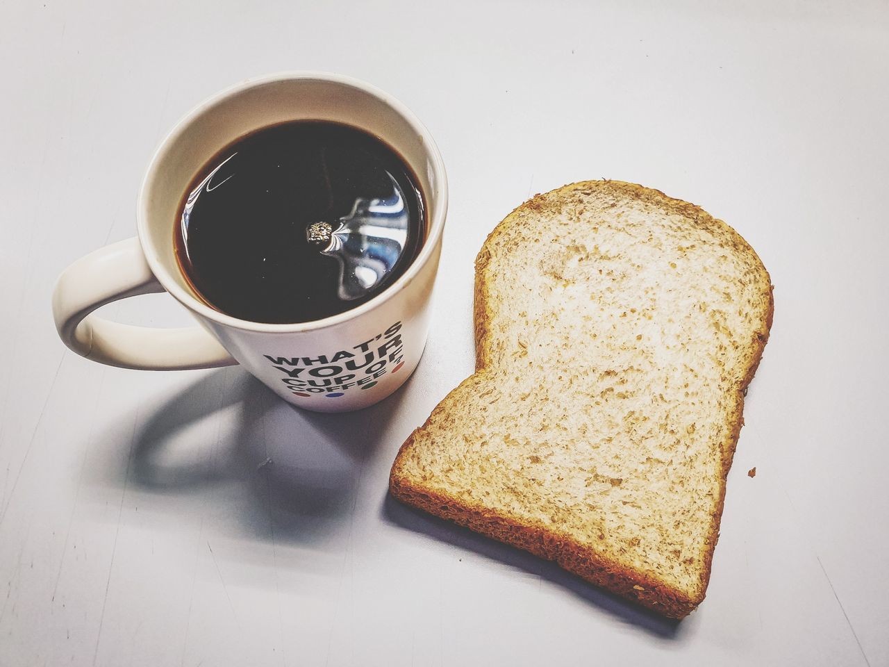 food and drink, cup, drink, mug, refreshment, food, bread, coffee, coffee cup, freshness, coffee - drink, indoors, breakfast, still life, table, meal, no people, close-up, ready-to-eat, toasted bread, hot drink, crockery, tea cup, non-alcoholic beverage, snack, toast