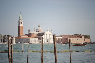 Church of san giorgio maggiore amidst canal against clear sky