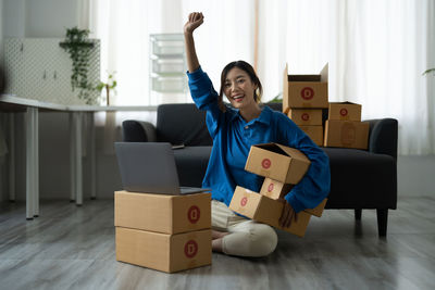 Portrait of smiling young man with gift box