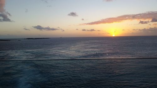 Scenic view of sea against sky at sunset