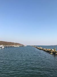 Scenic view of sea against clear blue sky