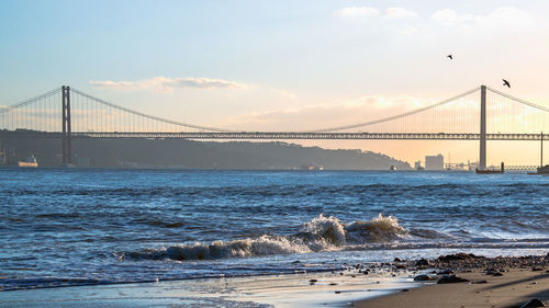 View of suspension bridge over sea