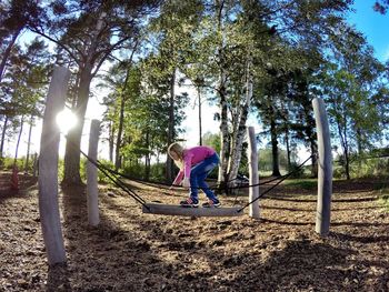 Full length of woman standing in park