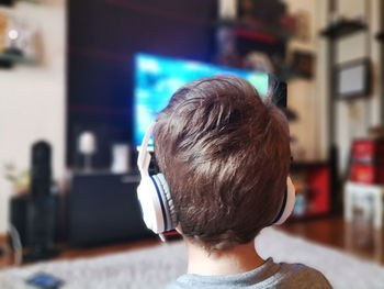 Rear view of boy at home