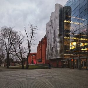 Buildings in city against sky