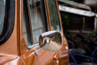 Close-up of side-view mirror in car