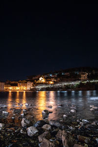 Illuminated buildings in city at night