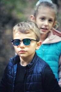 Portrait of boy and girl with sunglasses
