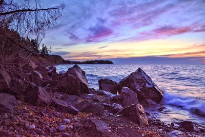 Scenic view of sea against sky at sunset