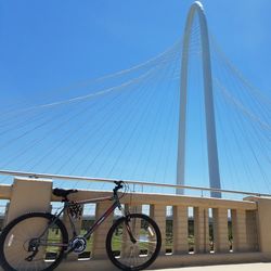 Low angle view of suspension bridge against clear sky