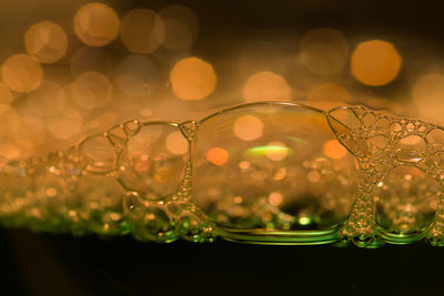 Close-up of water drop on glass