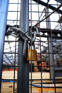 Close-up of padlocks on fence