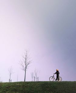 People walking on grassy field