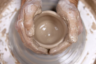 Cropped hand of person washing hands