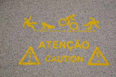 High angle view of yellow text on road