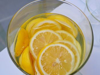 Close-up of lemon in glass on table