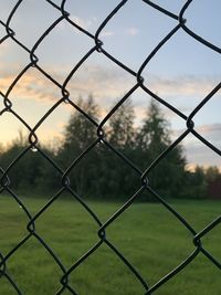 Full frame shot of chainlink fence against sky