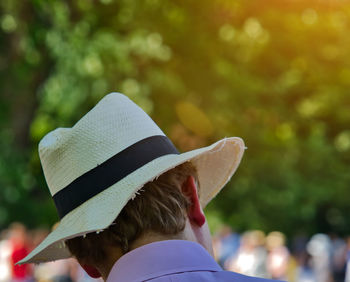 Rear view of man and woman wearing hat