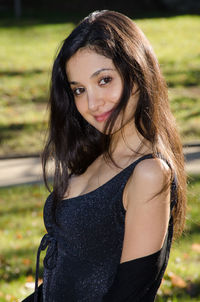Portrait of beautiful woman standing in park