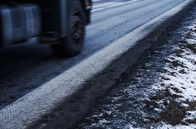 Close-up of tire car on road