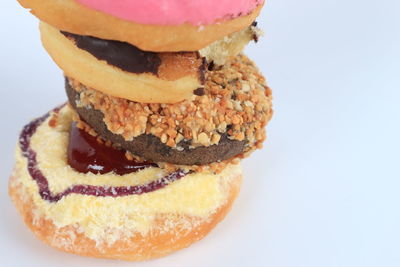 Close-up of cake on plate against white background