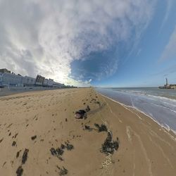 Scenic view of beach against sky