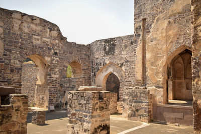 Ancient old historical golconda fort in india background stock photograph.