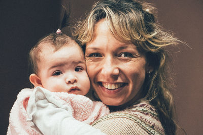 Portrait of woman with daughter