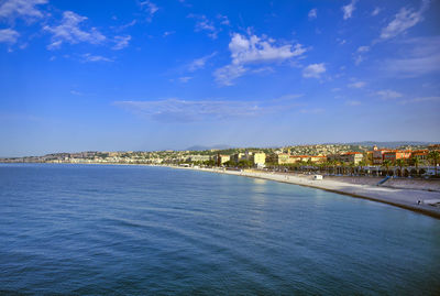 Scenic view of sea and buildings against sky