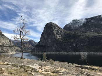 Scenic view of lake and mountains against sky