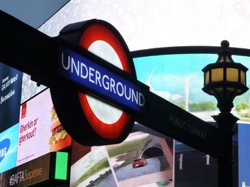 Close-up of information sign in city at night