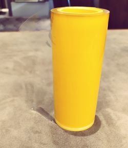 Close-up of yellow drink on table