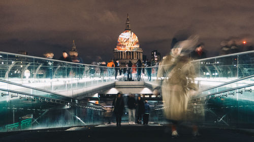 Blurred motion of illuminated bridge at night