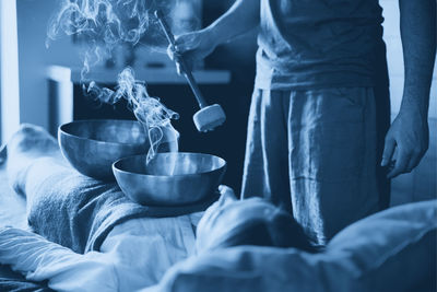 Midsection of man preparing food