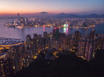 Aerial view of city lit up at night