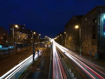 High angle view of light trails on road at night