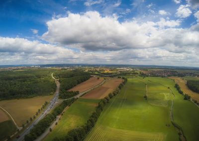 Aerial view of agricultural field against sky