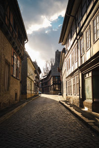 Footpath amidst buildings in town