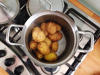 High angle view of boiled potatoes in pan on stove