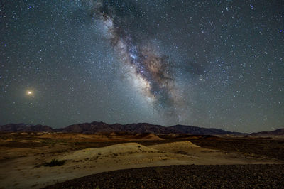 Scenic view of star field against sky at night