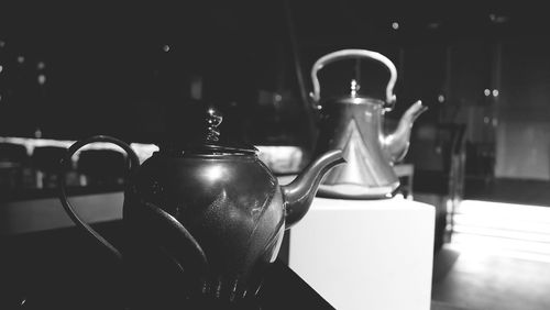 Teapots on table