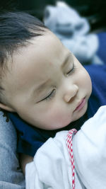 Close-up of cute boy with eyes closed