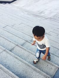 High angle view of boy on floor