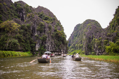 Tourists on boat in river