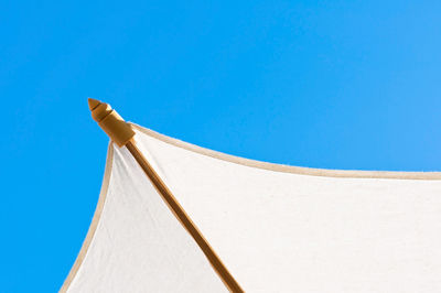 Low angle view of tent against clear blue sky