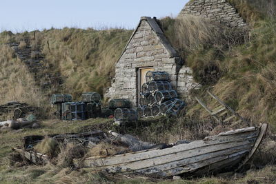 Built structures on field against sky