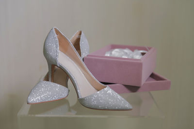 Close-up of shoes against white background