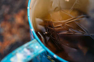 Close up of blue mug with cracked ice in it.