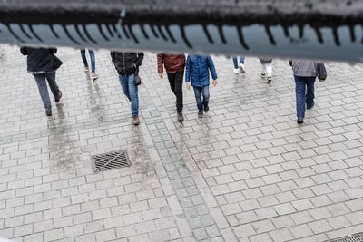 Low section of people walking on footpath